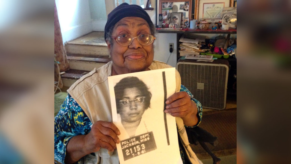 Lula White of New Haven holds the mug shot from her 1961 arrest.