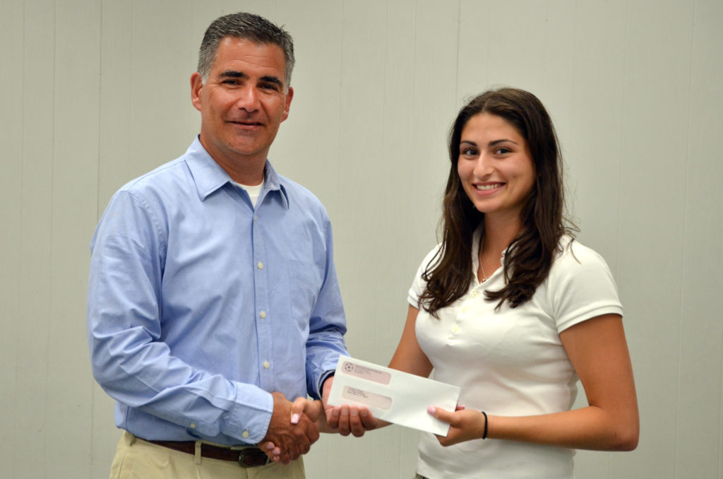 NHSC President Adam Acquarulo congratulates 2016 scholarship winner Christina DeFalco.