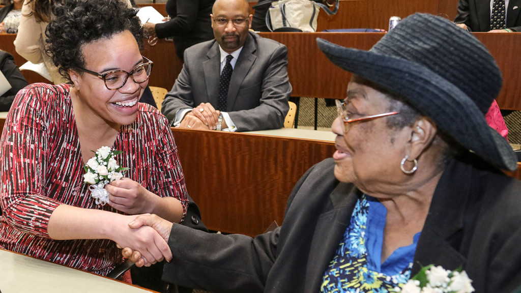 Quinnipiac University School of Law Alumna Stacy Renae Lynch, left, congratulates Lula White on Feb. 25. White, a former Freedom Rider during the civil rights movement, received the Quinnipiac University Black Law Students Association's Thurgood Marshall Award. Lynch, an alumna of the Quinnipiac School of Law, was the BLSA’s Community Service Award recipient. (Chris Beauchamp for Quinnipiac University)